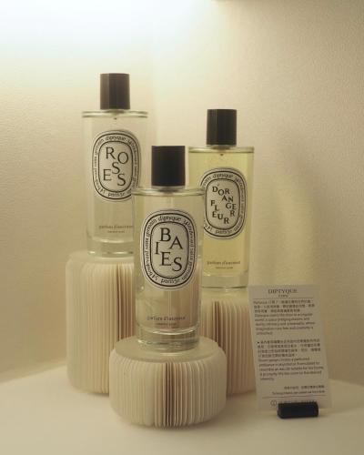 three bottles of soap sitting on a shelf at Swiio Hotel Daan in Taipei