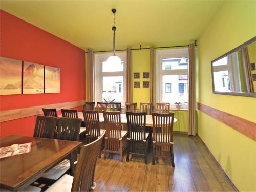 a restaurant with a dining room with a table and chairs at Gruppenhaus mit Sauna bis zu 18 Personen in Treuen