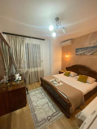 a bedroom with a large bed and a window at Riian Luxury Apartments in Ulcinj