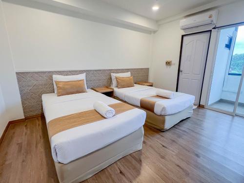 Katil atau katil-katil dalam bilik di Inspire House Hotel