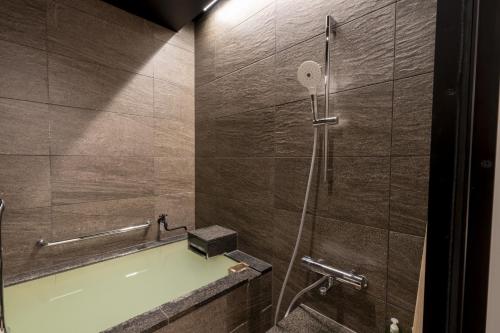 Ένα μπάνιο στο Kawaichiya Ryokan