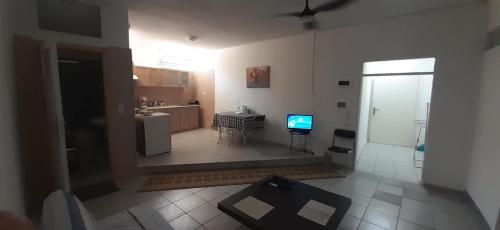 an aerial view of a living room with a kitchen at Ξενώνας OLEAVIA in Kalamata