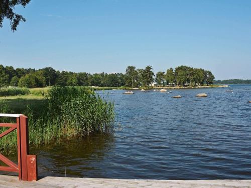 a body of water with rocks in the middle at 6 person holiday home in SÖLVESBORG in Björkenäs