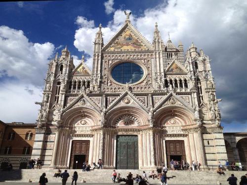 a large cathedral with people standing in front of it at Montaione Oasis Shared Villa in Montaione