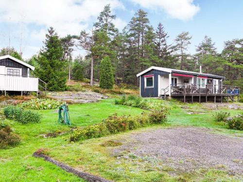 a small house in the middle of a yard at 6 person holiday home in HENÅN in Henån