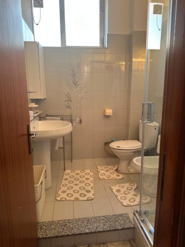 a bathroom with a toilet and a sink at Casa La Lavanda in Nicosia