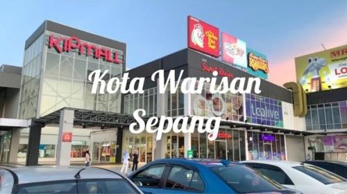 a group of cars parked in front of a shopping center at 4-room double storey house, 10km KLIA in Sepang