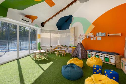 a room with a classroom with a table and chairs at Kimpton Los Monteros Marbella by IHG in Marbella