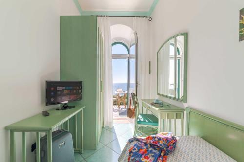 Телевизор и/или развлекательный центр в Hotel Casa del Sole