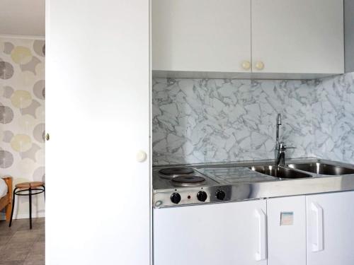 a kitchen with a sink and a counter top at 2 person holiday home in STRÖMSTAD-By Traum in Strömstad