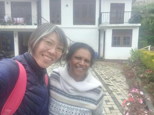 two women standing in front of a house at Silver Rose Holiday Home in Nuwara Eliya
