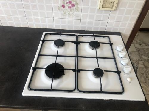 a stove top with four burners on a counter at Casa La Lavanda in Nicosia