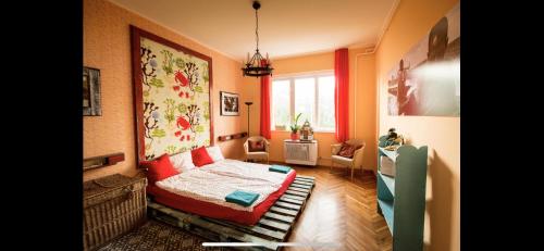 a small bedroom with a bed and a window at Best Location cosy Art flat in Budapest