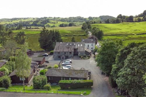 an aerial view of a house with cars parked in front at Bank View Barn at Pound Farm in Crook