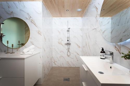 a bathroom with a sink and a mirror at Stay North - Harmonia 