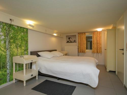 Ένα ή περισσότερα κρεβάτια σε δωμάτιο στο Rendeux Villa with Garden