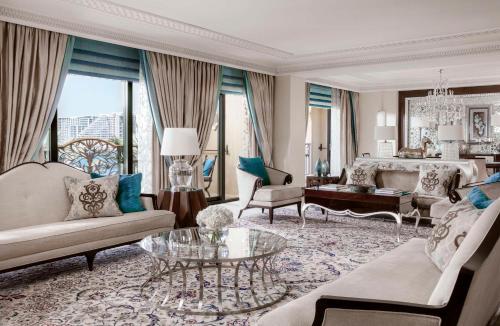 a living room with a couch and a table at One&Only Royal Mirage Resort Dubai in Dubai