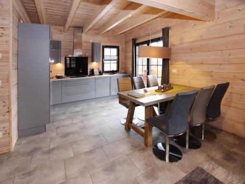 a kitchen and dining room with a table and chairs at Cottage, Schierke in Schierke