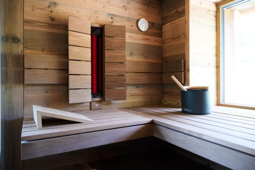 a sauna with a bench in a wooden cabin at Ziegelberg Chalets in Füssen