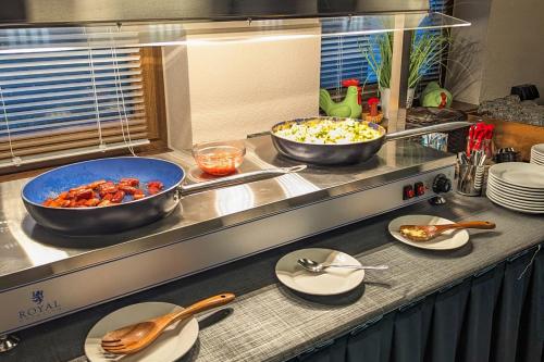 a kitchen with two bowls of food on a counter at Ferien Hotel Cottbus in Kolkwitz
