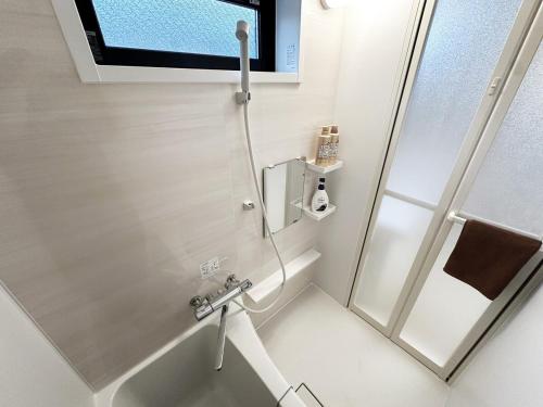 a bathroom with a shower and a sink at Great access to Shibuya Big supermarket nearby in Wada