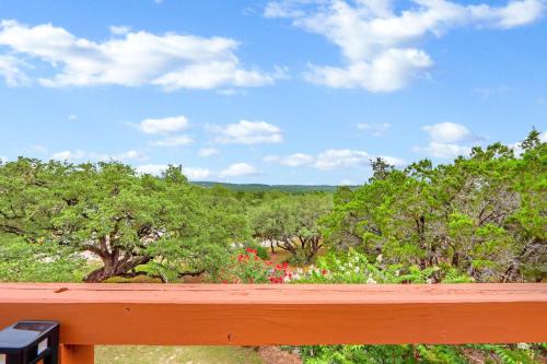 a view of a garden with trees and flowers at The Summit in Wimberley