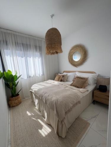 a bedroom with a bed and a large window at PMT22 - Luxury villa with private heated pool and jacuzzi in Torrevieja