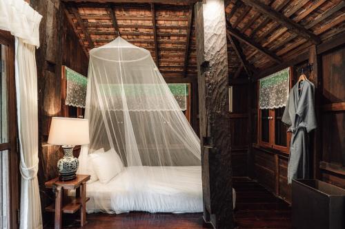 Katil atau katil-katil dalam bilik di Chantra Khiri Chalet Chiang Mai