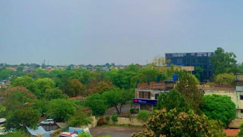 a view of a city with trees and a building at 8 Rawal Inn in Dargai