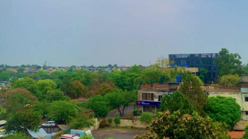 a view of a city with trees and a building at 8 Rawal Inn in Dargai
