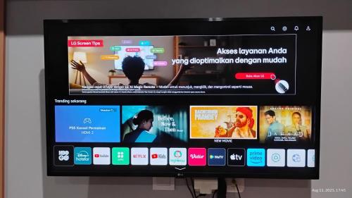 a television screen with many different apps on it at Varisha Homestay 2 Bedrooms, PS5, E-bike in Ngaglik