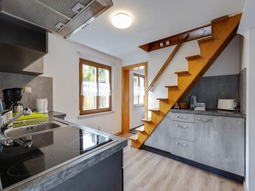 a kitchen with a sink and a stairway at Ferienhaus im Thüringer Wald in Wutha-Farnroda