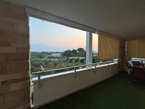 a room with a large window with a view at B&B Bari Apartment by Margi in Bari