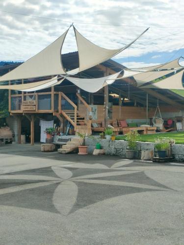 a building with a large tent on top of it at Nisihof, Buurenzimmer Family or Single in Oberkirch