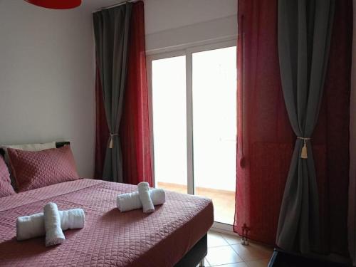 Postel nebo postele na pokoji v ubytování Alexandroupolis City Golden Shores