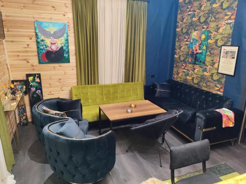 a restaurant with a table and chairs in a room at Wooden house nica in Lagami