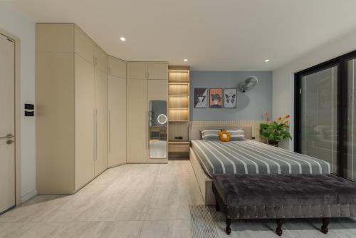 a bedroom with a bed and a television in it at Thảo Nguyên Homestay in Hanoi