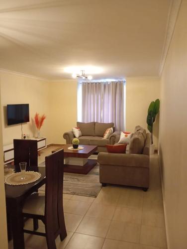 TV a/nebo společenská místnost v ubytování Caykal luxury homes