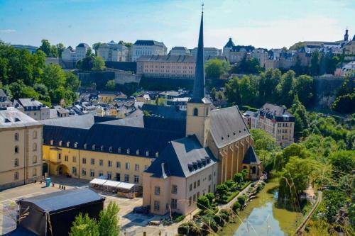 an aerial view of a large building with a tall tower at Tiny Loft | 2 personen in Fouhren