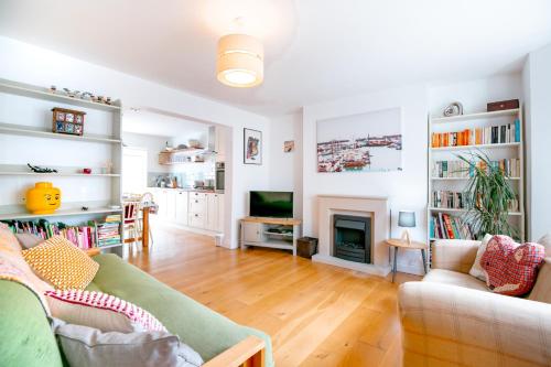 a living room with a couch and a fireplace at Perfect Booking Near Ramsgate Station And Beach in Ramsgate
