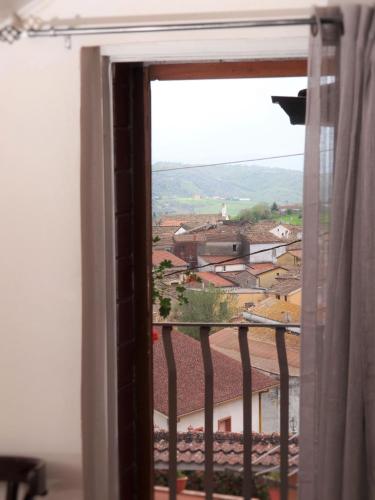 a view of a town from a window at Domus Tua in Pietrelcina