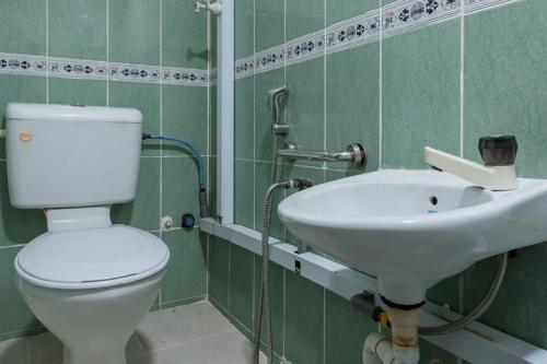 a bathroom with a toilet and a sink at Persona Boutique Hotel in Malacca