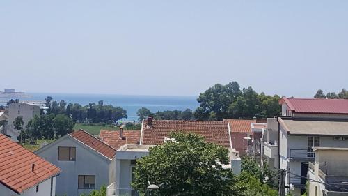 a group of houses with the ocean in the background at Aparthotel Monterria in Bar