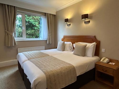 Cama o camas de una habitación en Birmingham Great Barr Hotel