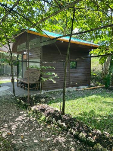 a house with a bench in front of it at Sobral Rice Terraces View in Antihon