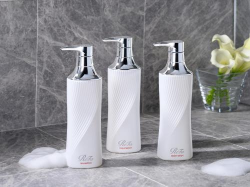 three bottles sitting on a counter in a bathroom at Tokyu Stay Tsukiji - Tokyo Ginza Area in Tokyo
