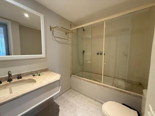 a bathroom with a shower and a sink and a toilet at Hotel Ninety Alameda Lorena São Paulo in Sao Paulo
