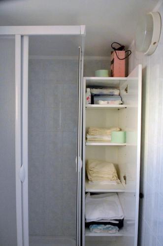 a walk in closet with a glass door at Casa delle Onde in San Vito