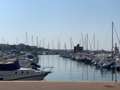a bunch of boats docked in a harbor at Casa Vacanze Sos Vrades in Portoscuso