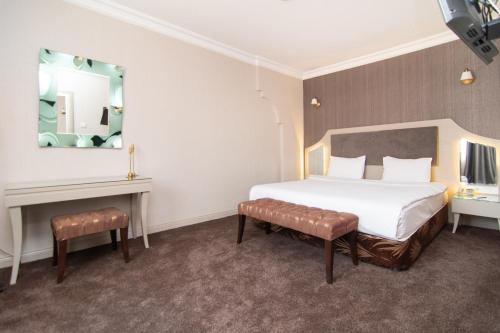 Ένα ή περισσότερα κρεβάτια σε δωμάτιο στο Asrin Park Hotel & Spa Convention Center